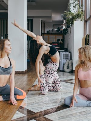 young-attractive-women-practicing-yoga-near-P47PWGD-min (1)